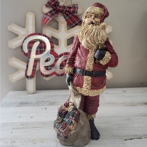 Hand painted pecan resin Santa statue